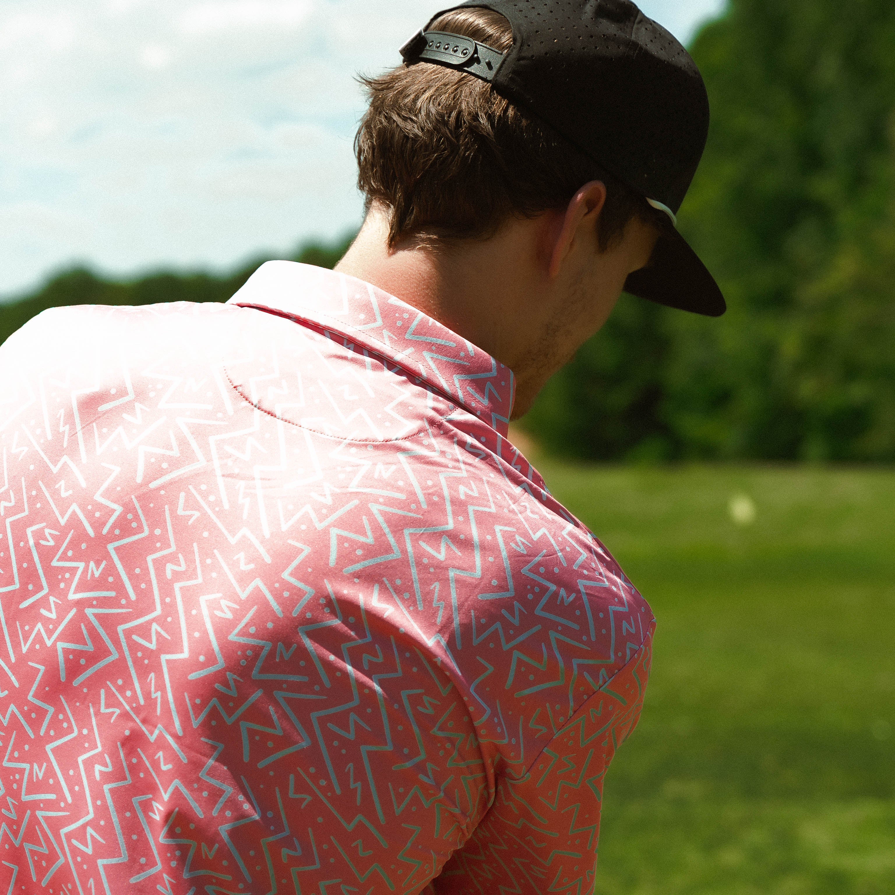 Awesome bright men’s golf polo by for the birds golf co with throwback zig zag pattern