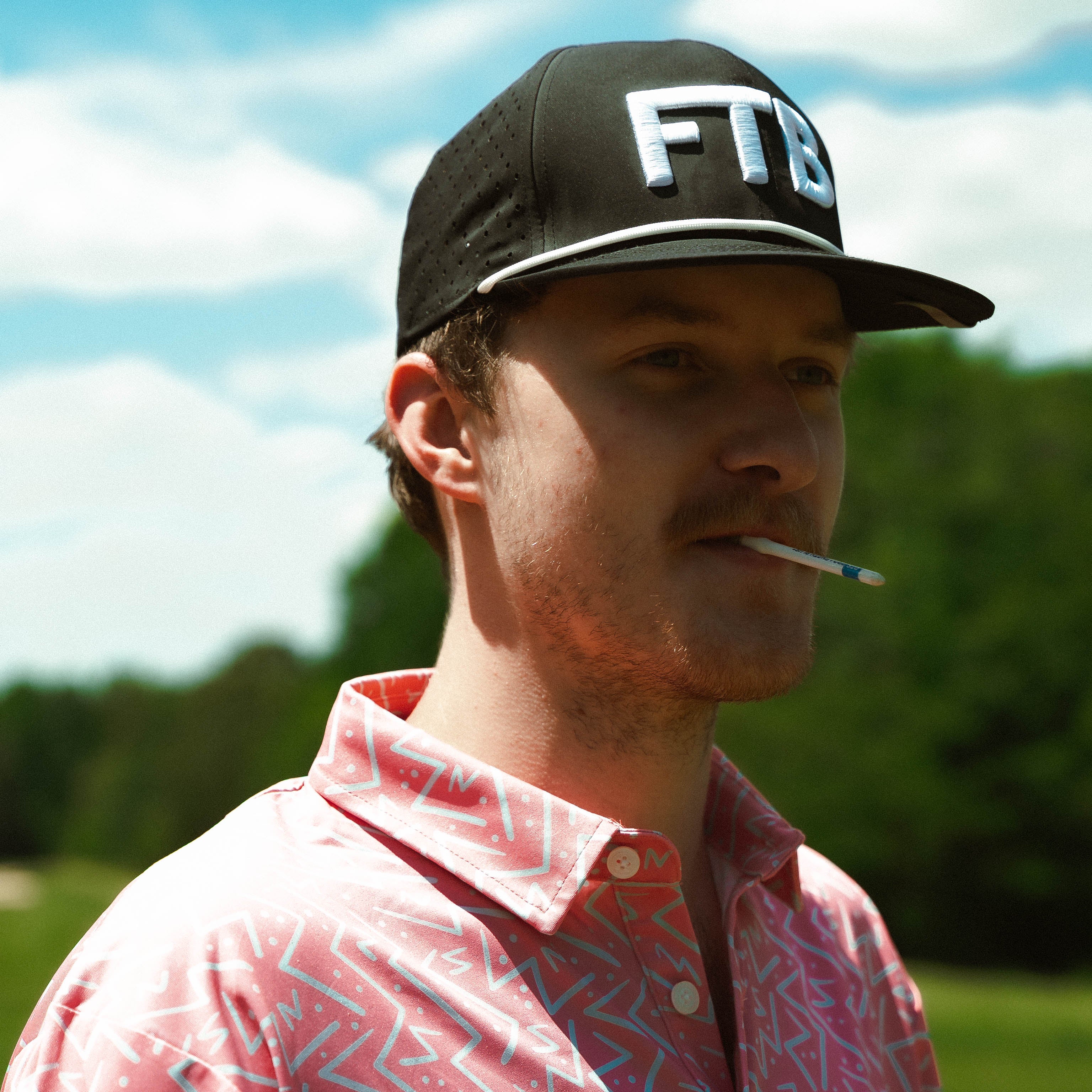 Awesome bright men’s golf polo by for the birds golf co with throwback zig zag pattern