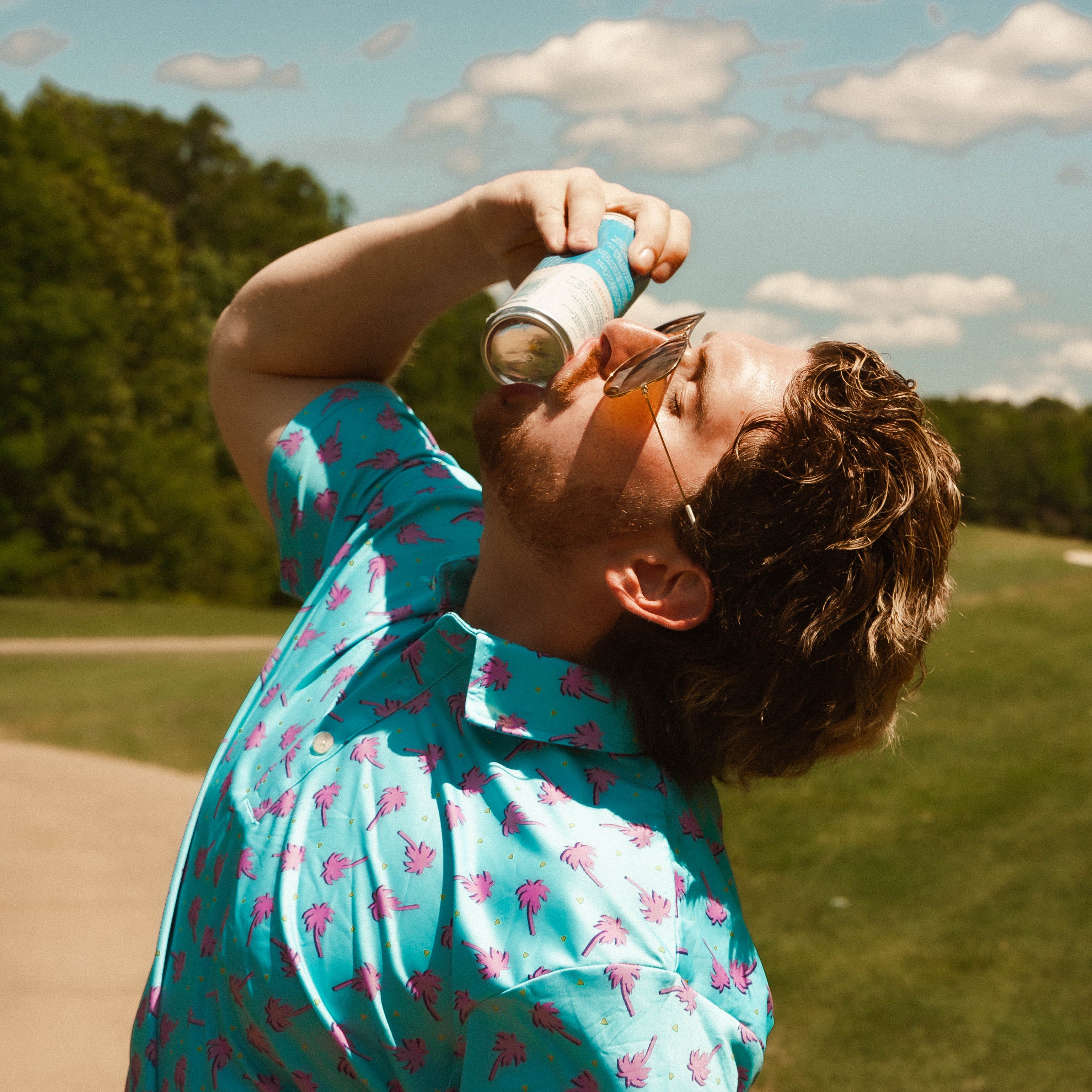 For the birds golf mens patterned golf polo with tropical palm tree patters.