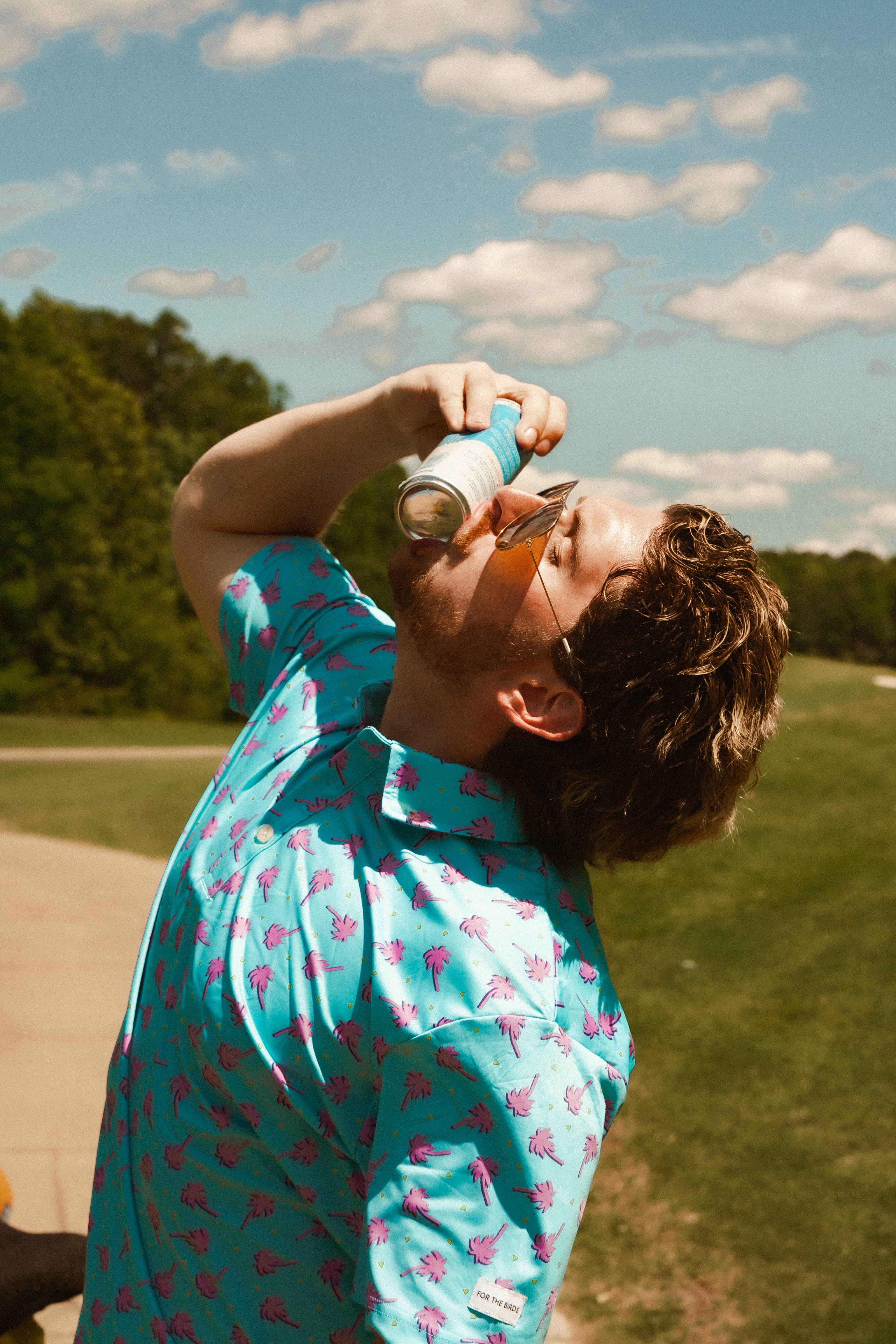 For the birds golf mens patterned golf polo with tropical palm tree patters.
