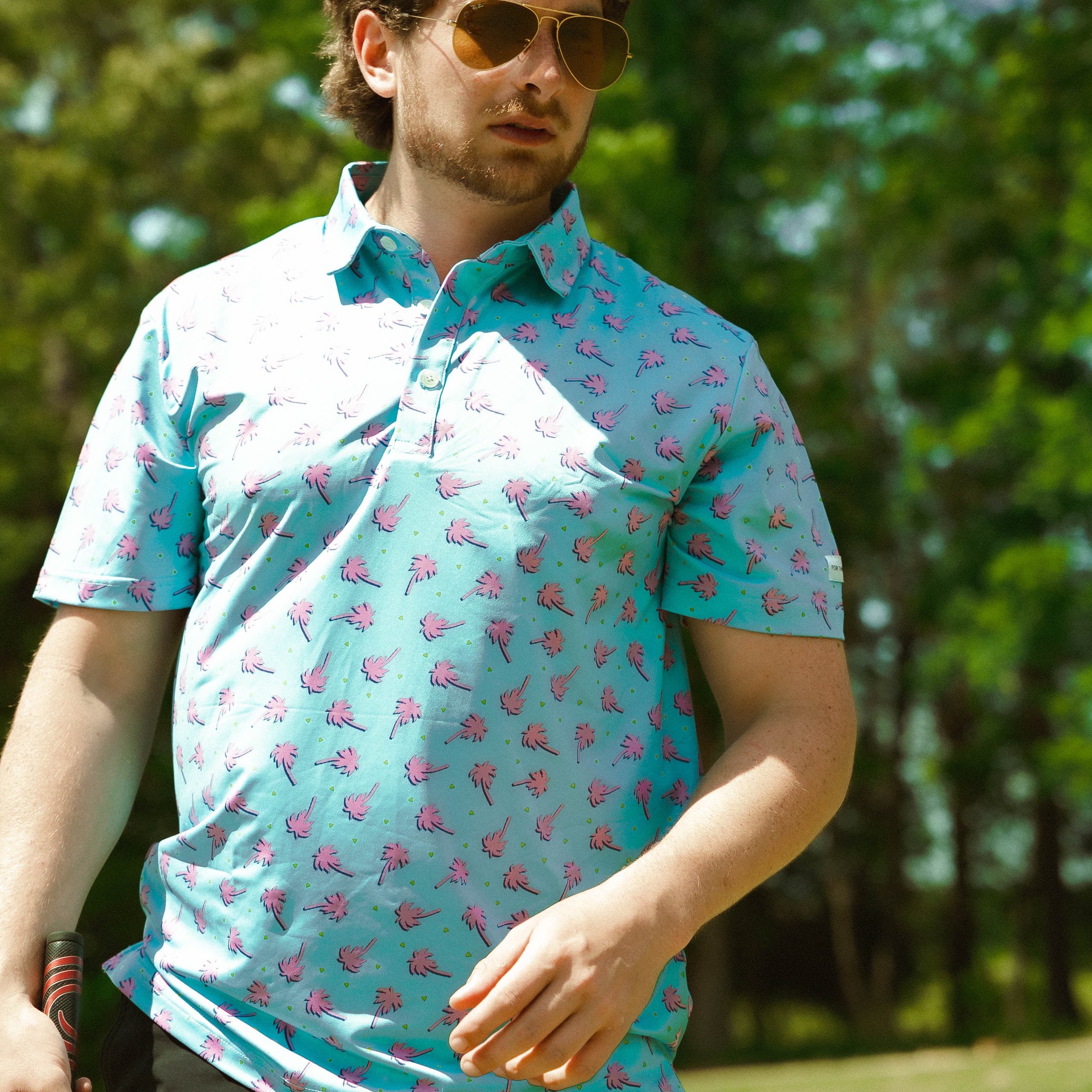 For the birds golf mens patterned golf polo with tropical palm tree patters.