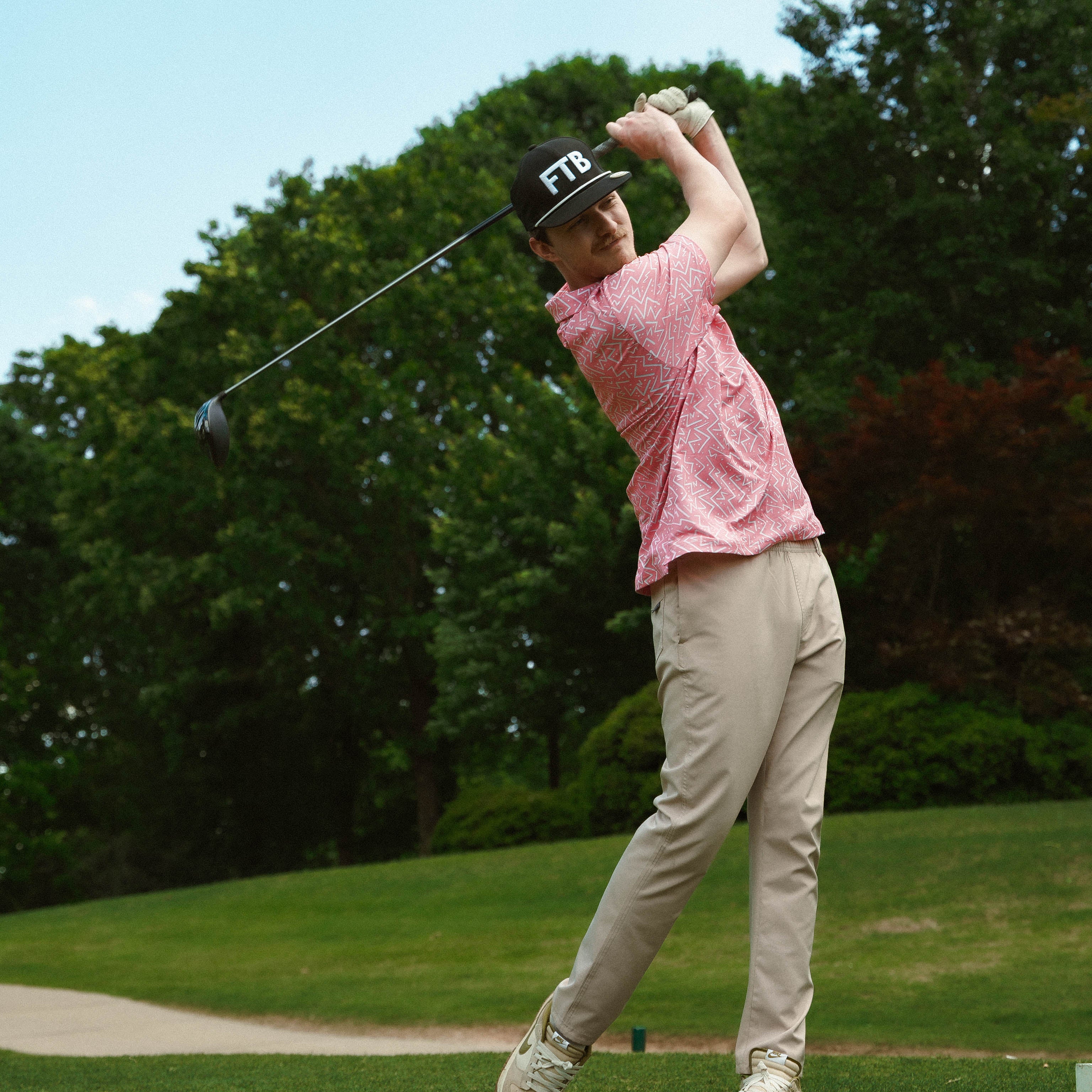 Awesome bright men’s golf polo by for the birds golf co with throwback zig zag pattern