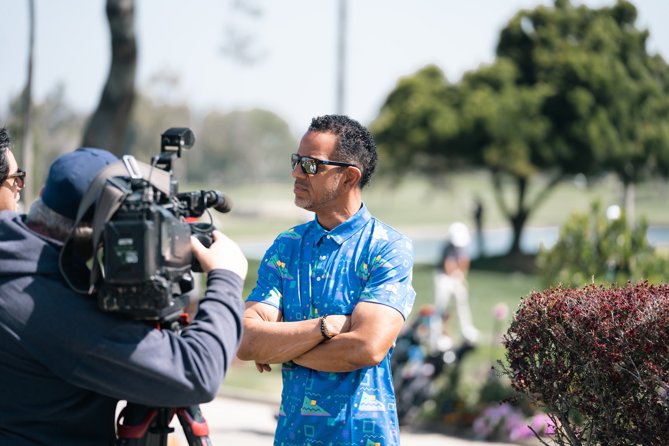 Andre Reed wearing Breasy apparel business trip throwback 90s golf polo