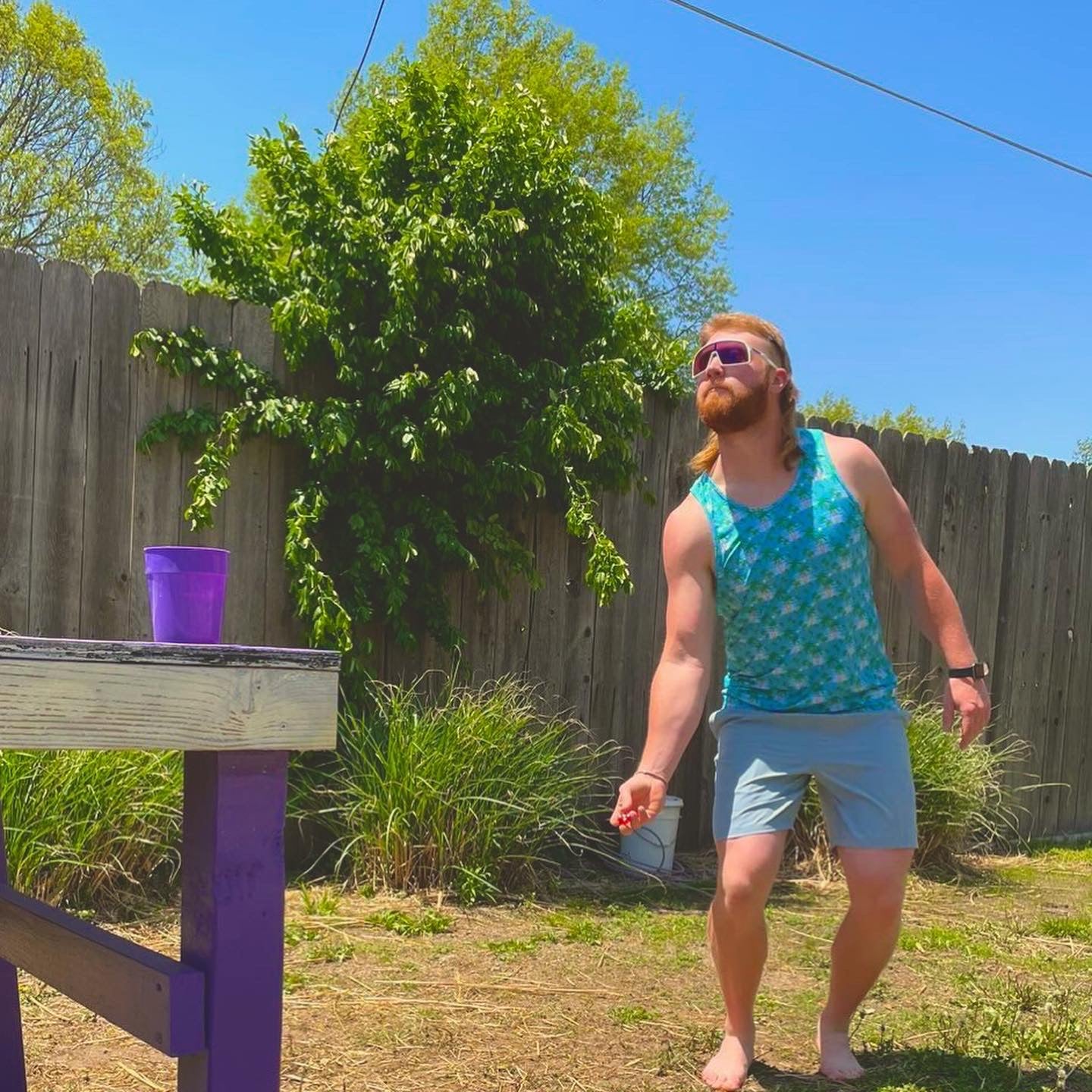 Randen Plattner wearing for the birds tropical island breeze tank top
