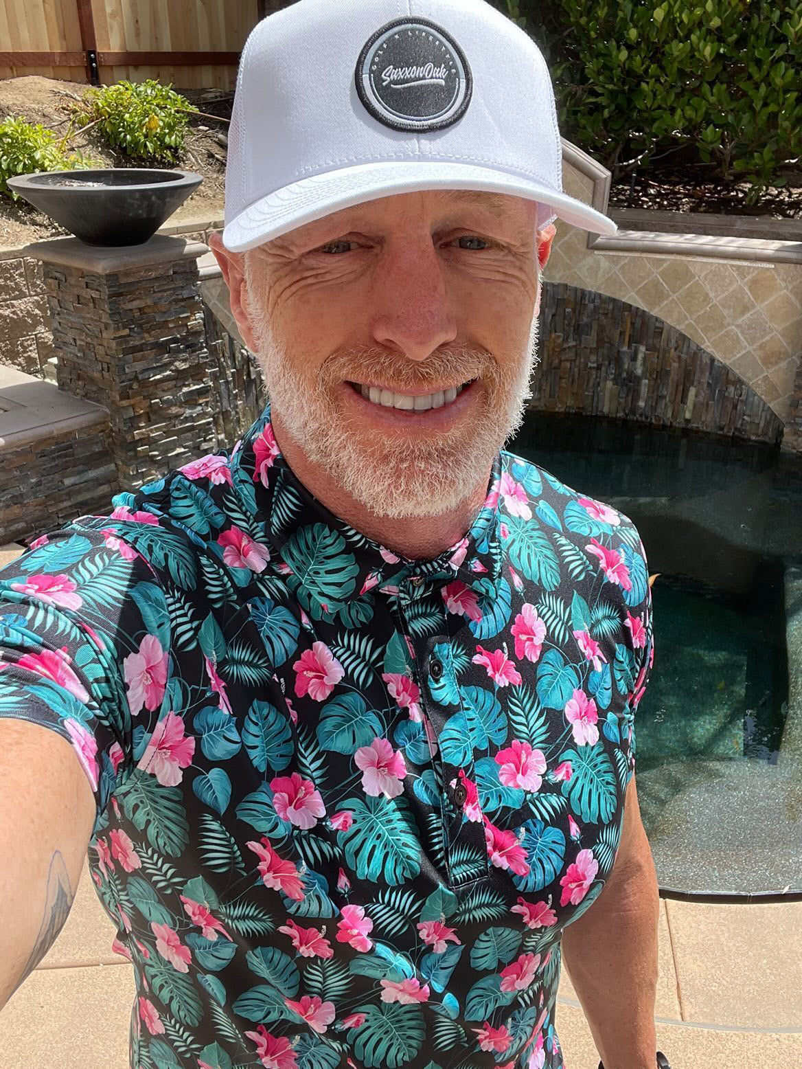 Jeff Garcia wearing for the birds golf polo Hawaiian Friday tropical floral golf polo