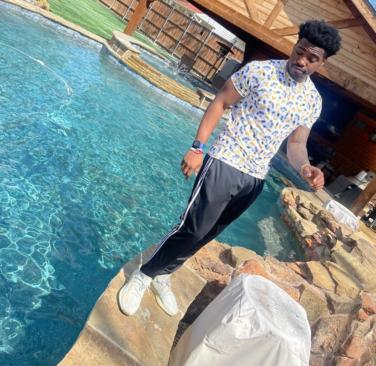 Jalon Daniels wearing tropical pineapple golf shirt