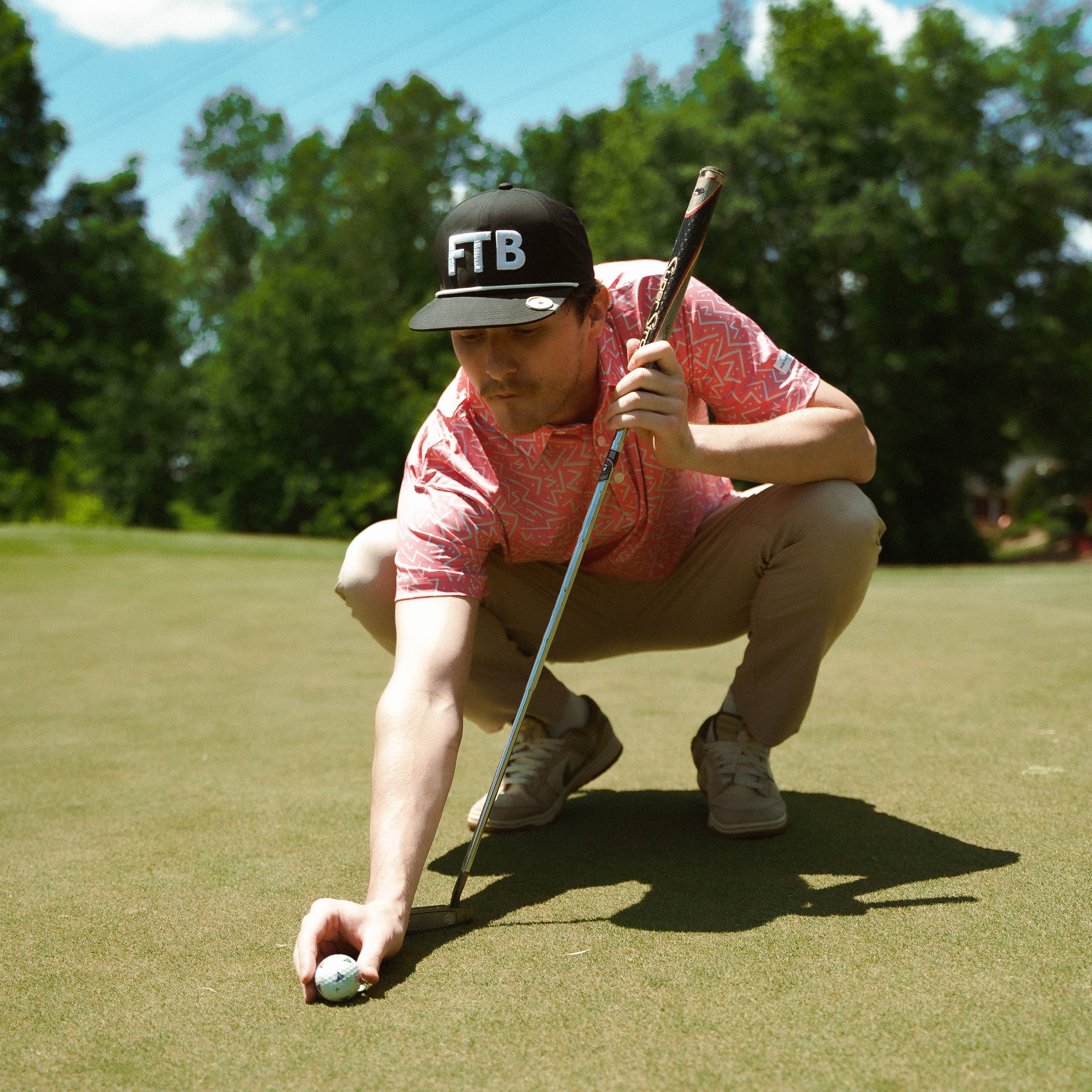 Awesome bright men’s golf polo by for the birds golf co with throwback zig zag pattern