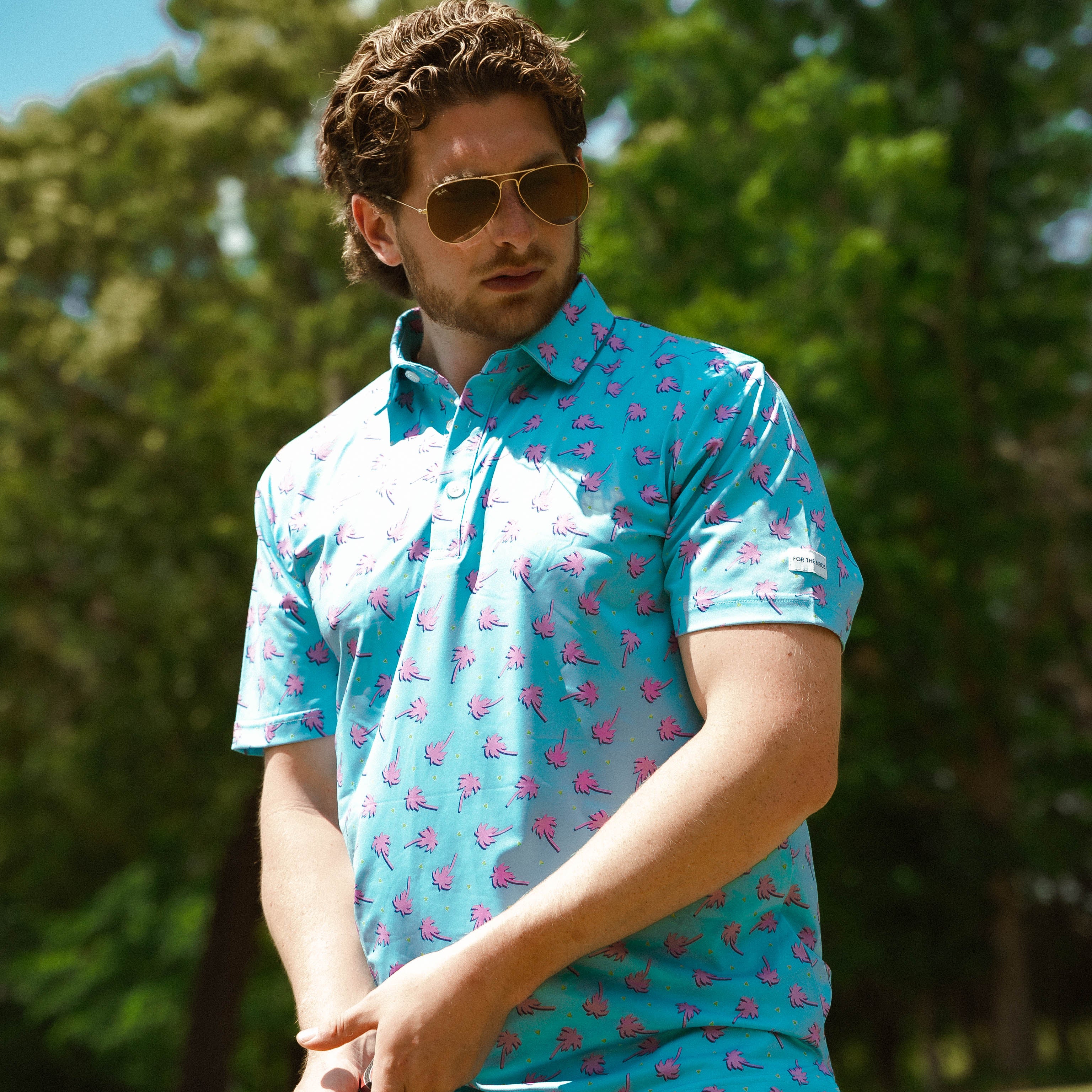 For the birds golf mens patterned golf polo with tropical palm tree patters.