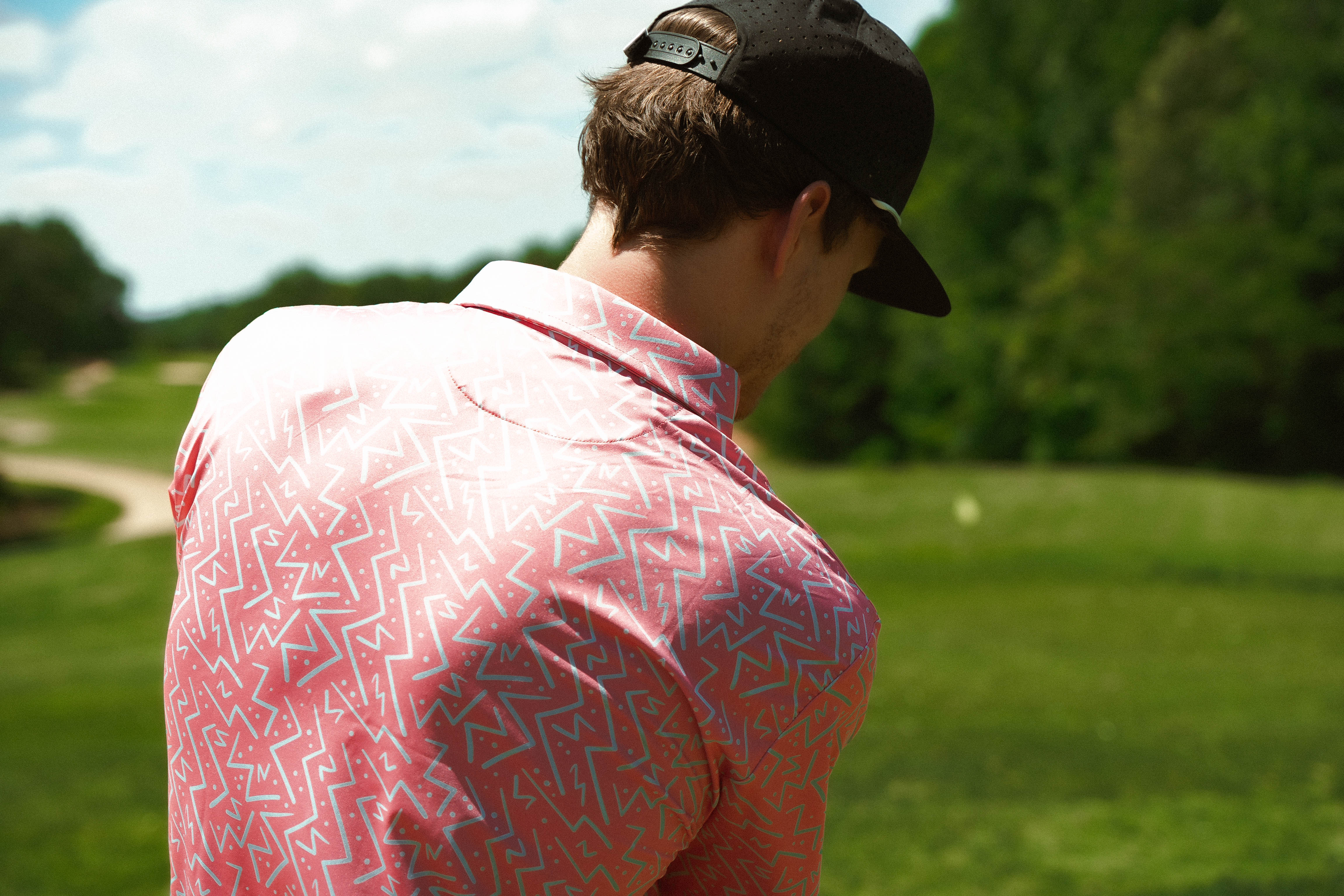 Awesome bright men’s golf polo by for the birds golf co with throwback zig zag pattern
