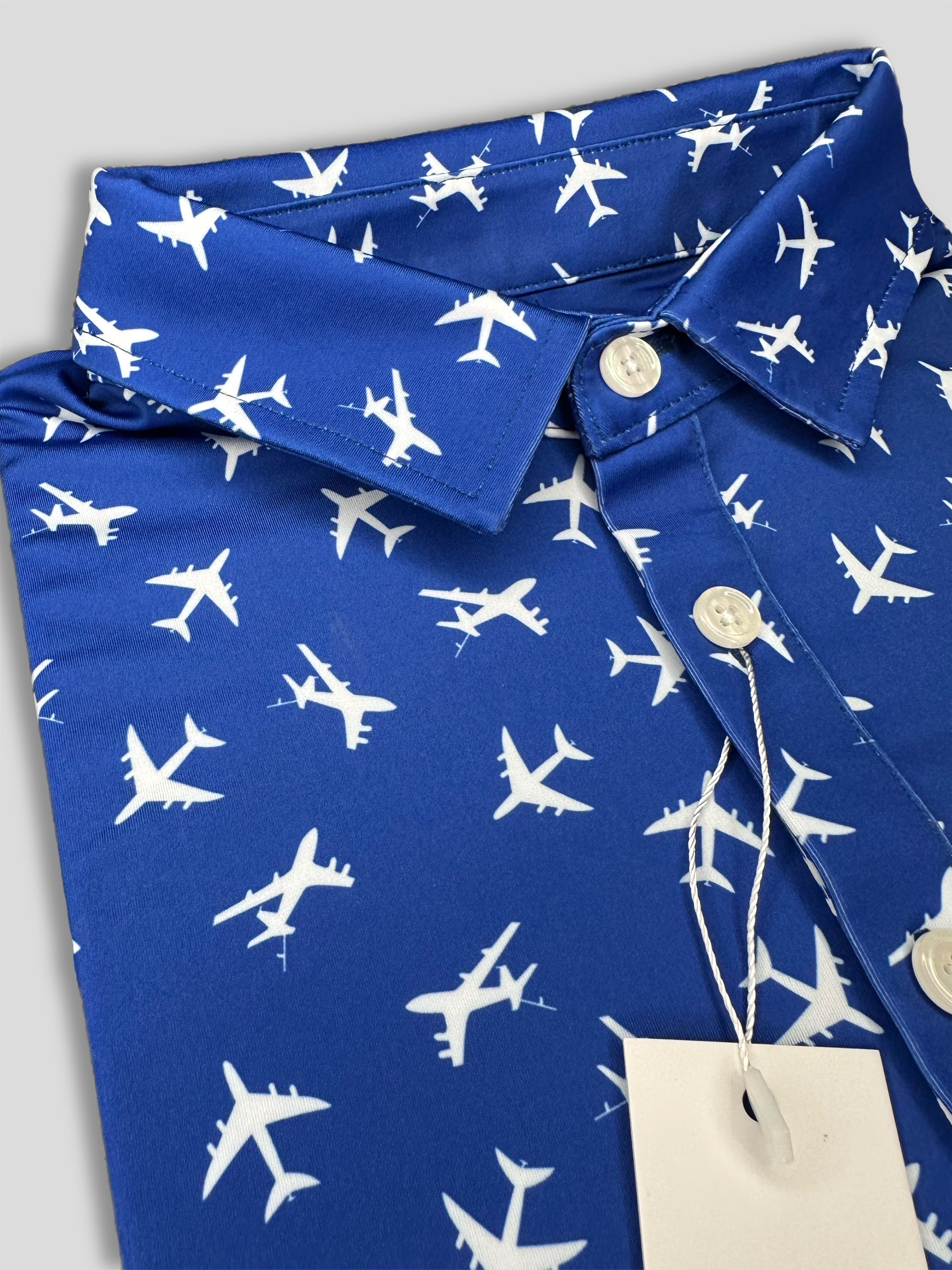 For the birds fun men’s golf polos that come in awesome patterns such as tropical, vintage 90’s, dad themed, and more. 